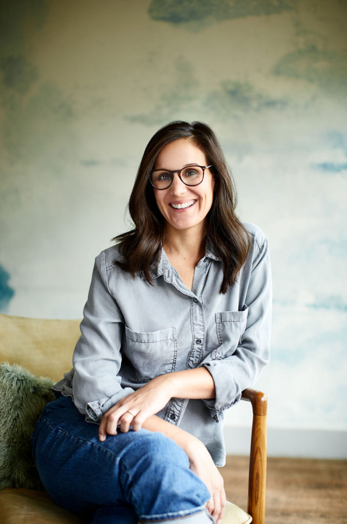 Portrait of Shannon Cosentino-Roush smiling and sitting comfortably